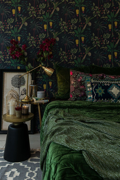 dark bedroom with luxurious plush jewel tones and soft velvets